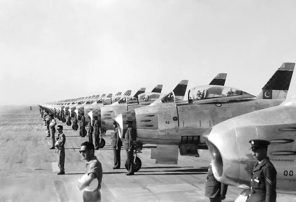 American-built F-86F Sabre jets of the Pakistan Air Force’s Falcons aerobatic team lined up with their crews at PAF Base Mauripur, February 1958