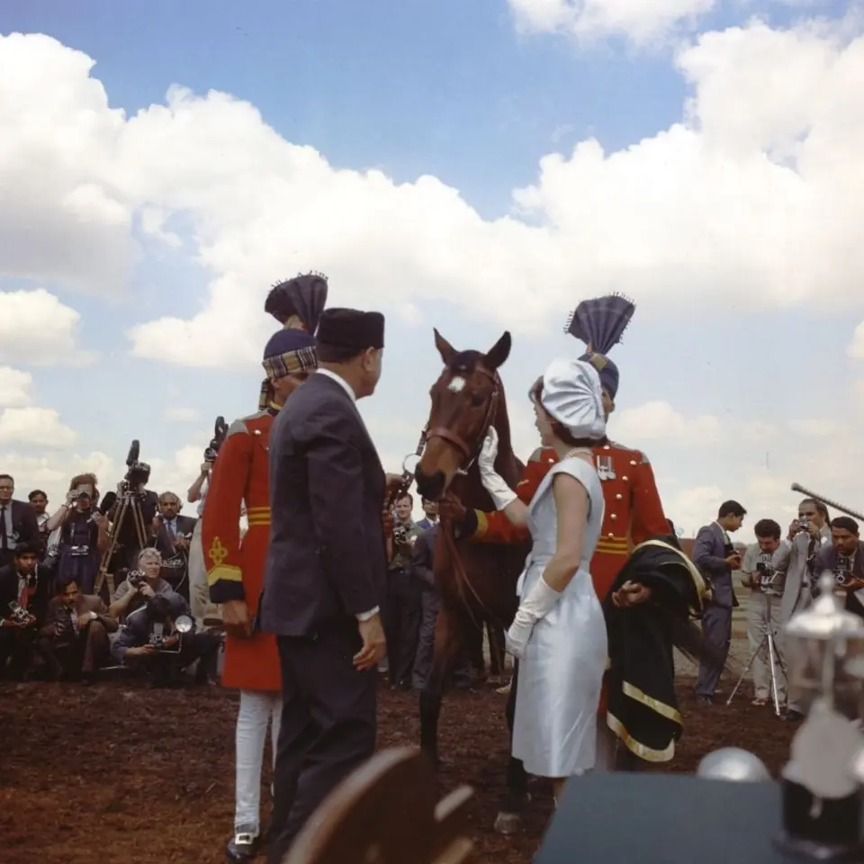 President Mohammed Ayub Khan of Pakistan presents Jacqueline Kennedy with a bay gelding as a gift, 22 March 1962