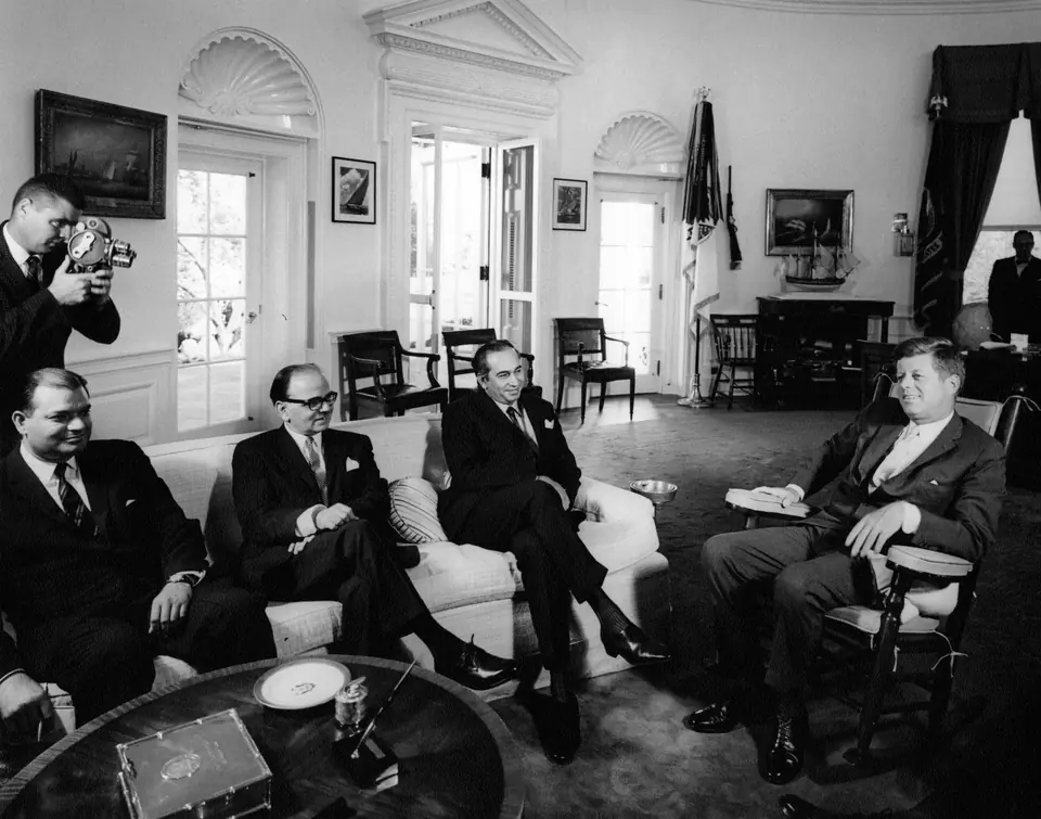 President John F. Kennedy, in his rocking chair, meets Pakistan’s Foreign Minister Zulfikar Ali Bhutto, Ambassador Ghulam Ahmed and an embassy official in the Oval Office, 4 October 1963
