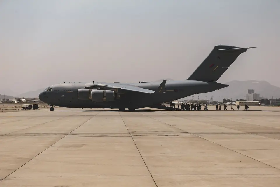 Evacuees board a C-17 Globemaster III during the evacuation at Hamid Karzai International Airport, Kabul, 20 August 2021